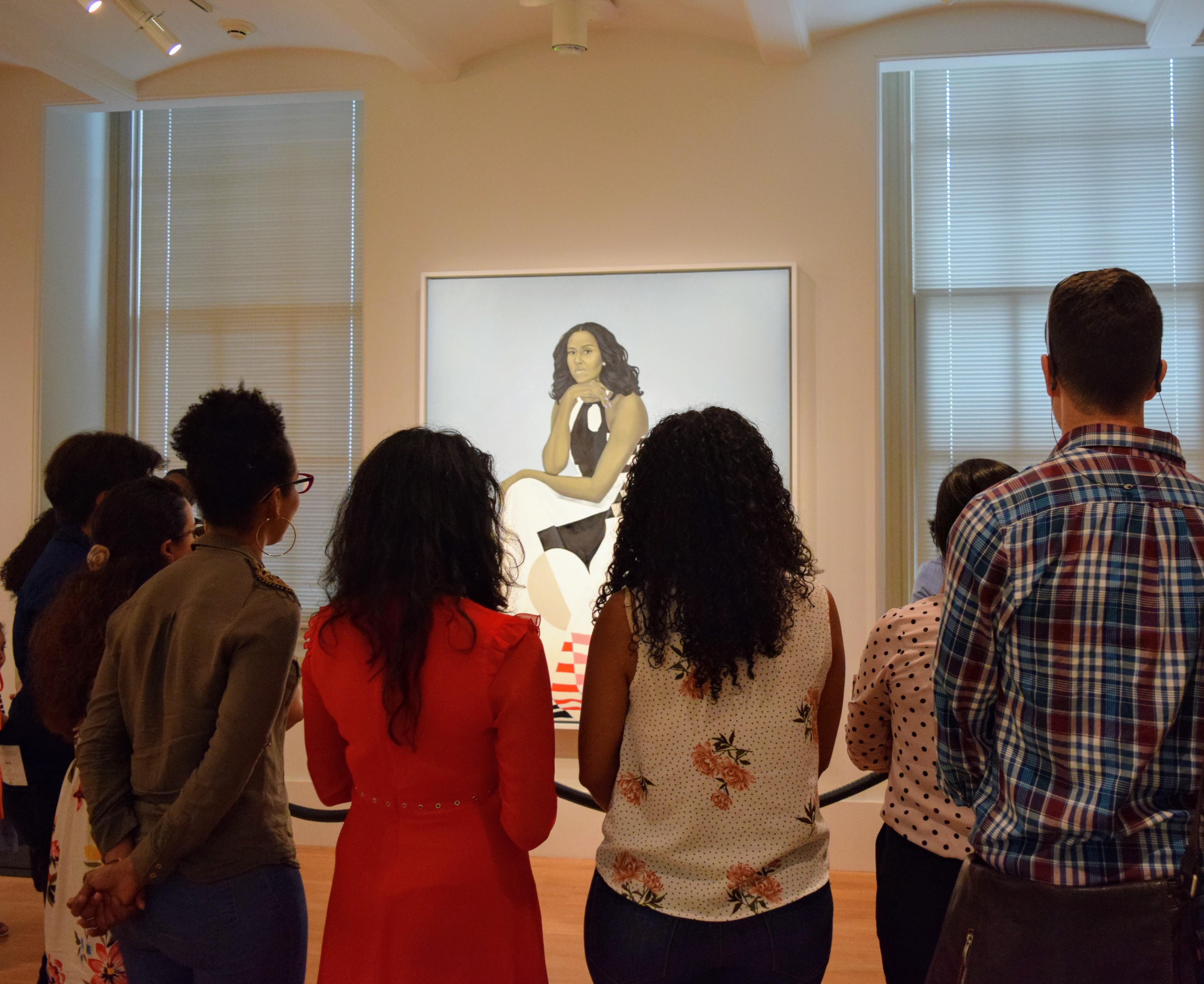 Fellows viewing Michelle Obama portrait.